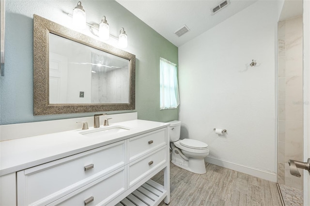 full bathroom featuring wood finished floors, visible vents, toilet, and walk in shower