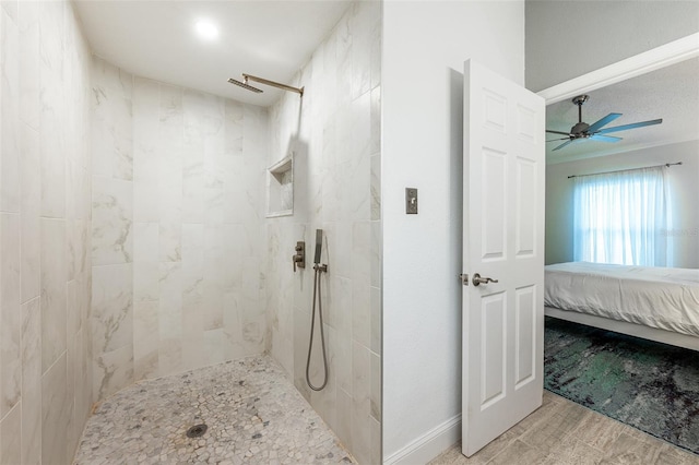 bathroom featuring ensuite bathroom, tiled shower, and a ceiling fan