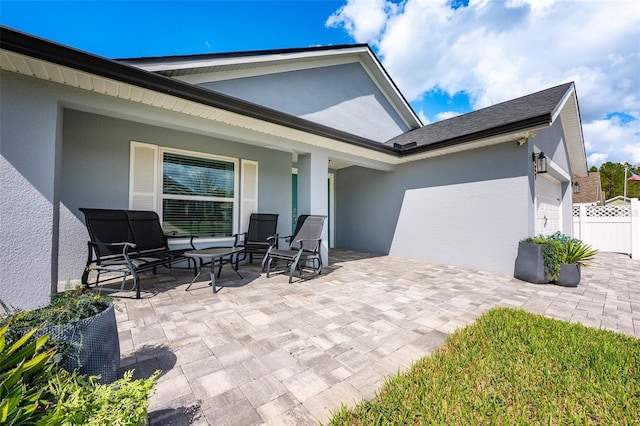 view of patio / terrace featuring fence