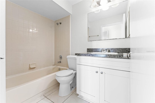 bathroom featuring vanity, tile patterned flooring, shower / tub combination, and toilet