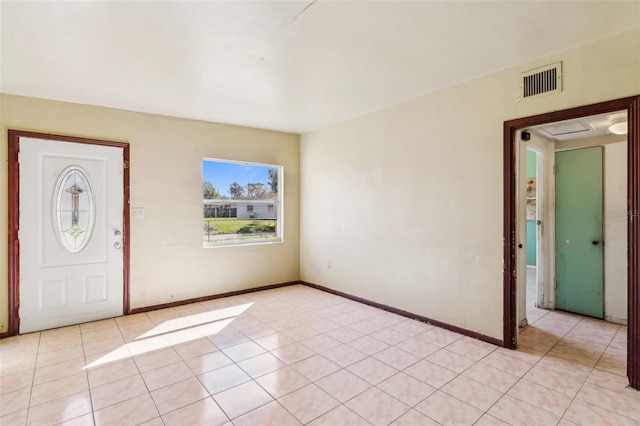 entrance foyer with light tile patterned floors, visible vents, and baseboards