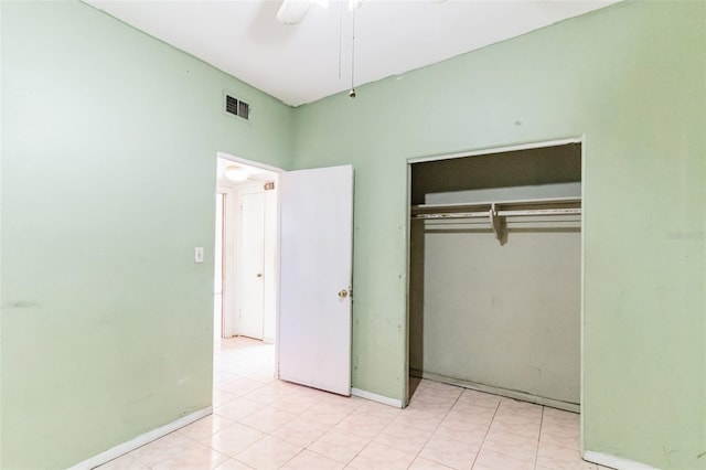 unfurnished bedroom featuring a closet, visible vents, ceiling fan, and baseboards