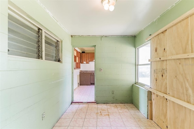 hallway featuring light tile patterned flooring