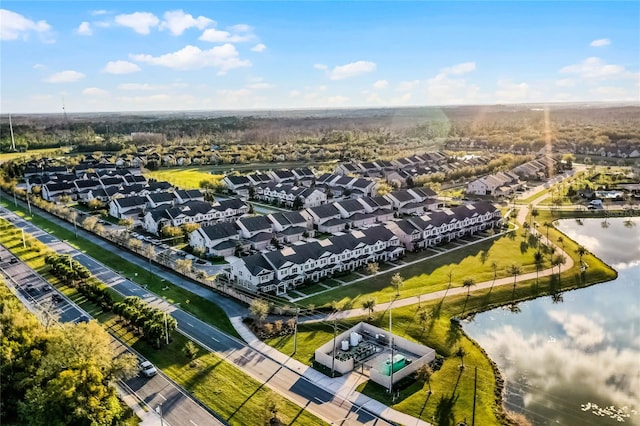 drone / aerial view with a residential view and a water view