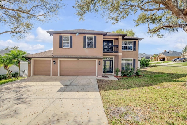 view of front of home featuring stucco siding, concrete driveway, a balcony, a garage, and a front lawn