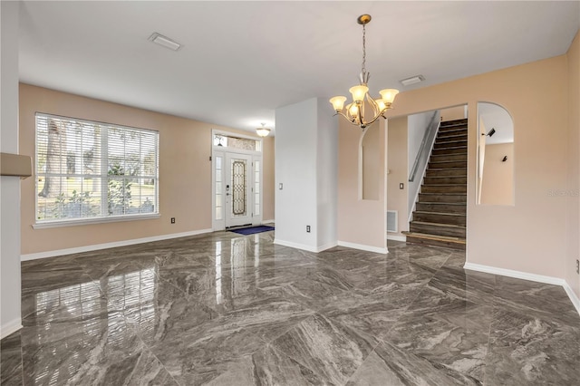 empty room with stairs, marble finish floor, visible vents, and baseboards