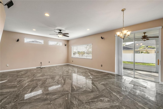 unfurnished room featuring recessed lighting, marble finish floor, baseboards, and ceiling fan with notable chandelier