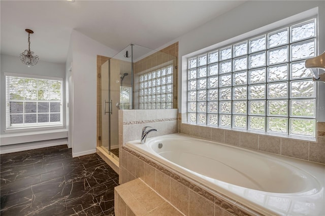 full bathroom with a stall shower, marble finish floor, a garden tub, and baseboards