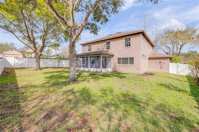 back of property featuring a sunroom, a lawn, a fenced backyard, and a gate