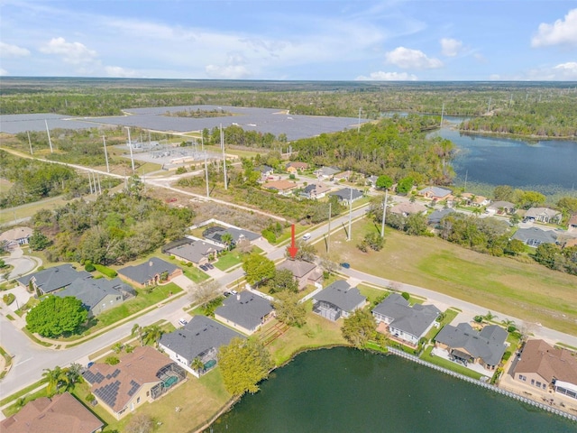 bird's eye view featuring a water view and a residential view