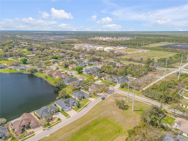 bird's eye view with a water view and a residential view