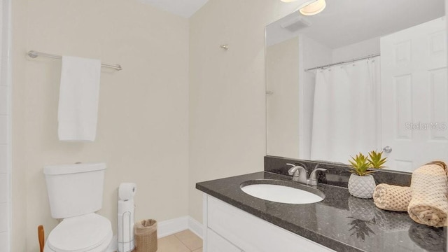 full bath with visible vents, toilet, vanity, baseboards, and tile patterned floors