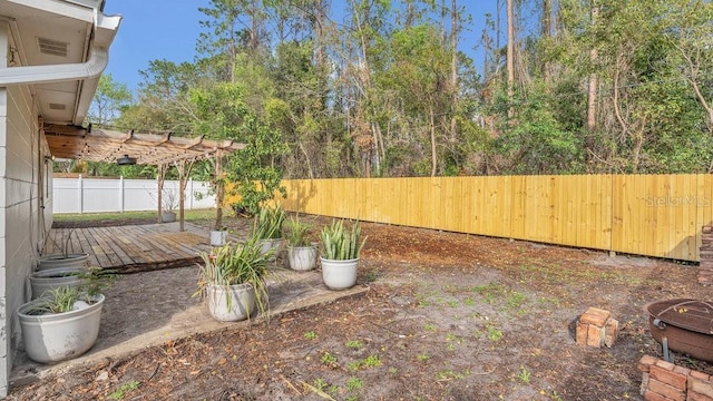 view of yard with a fenced backyard, a pergola, and a patio