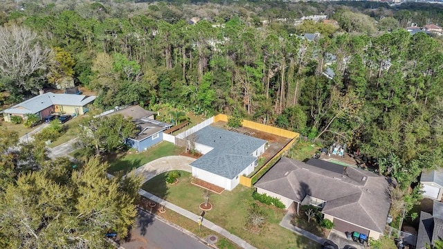 drone / aerial view featuring a view of trees