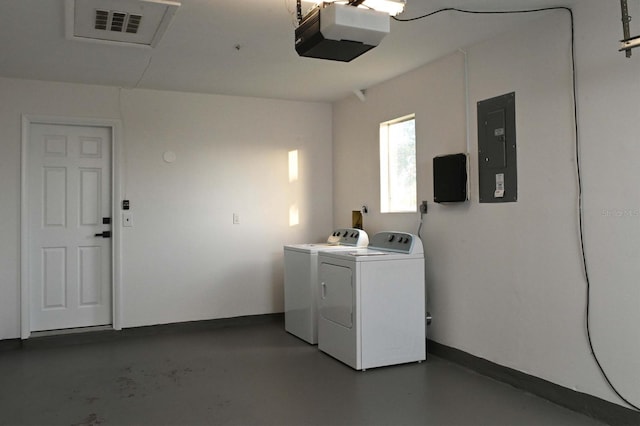 laundry room featuring visible vents, electric panel, baseboards, and washer and dryer