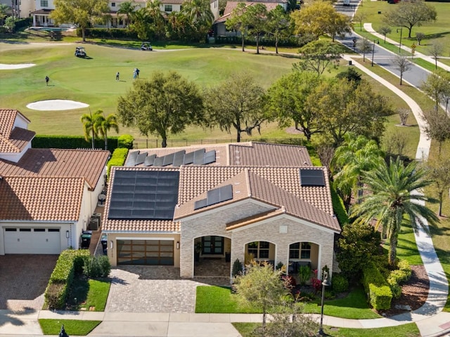 birds eye view of property with view of golf course