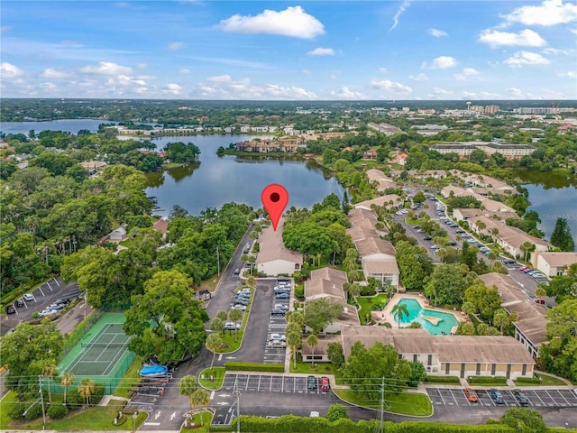 birds eye view of property with a water view