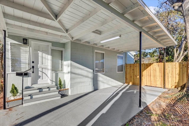 view of patio / terrace featuring entry steps and fence