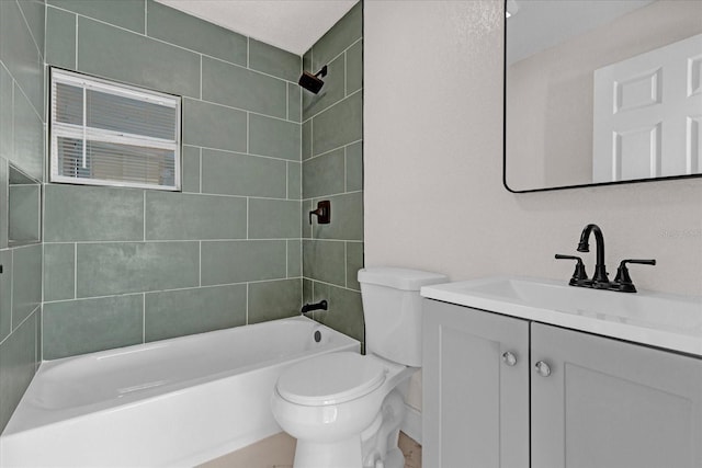 bathroom featuring bathtub / shower combination, vanity, and toilet