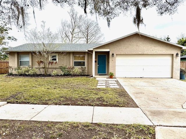 ranch-style home featuring stucco siding, concrete driveway, fence, a garage, and a front lawn