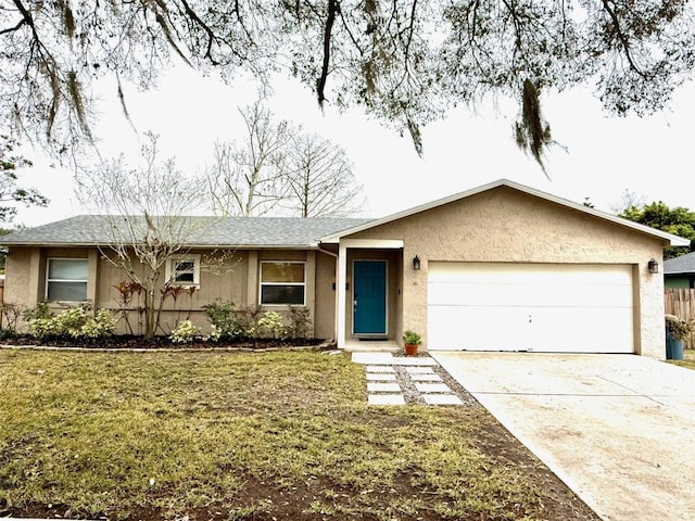 ranch-style house with a garage, a front lawn, concrete driveway, and stucco siding