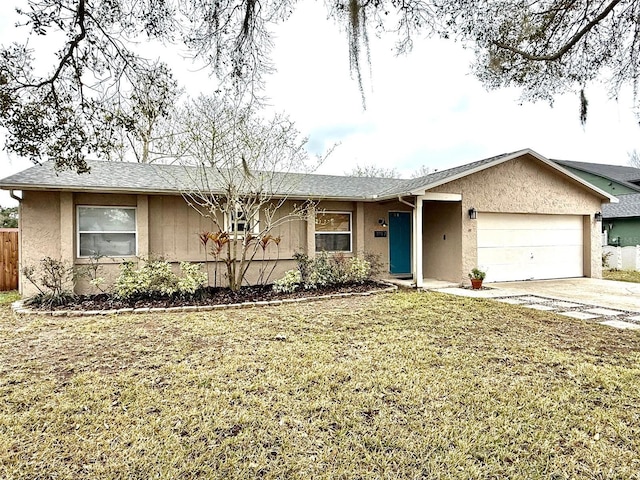 ranch-style home featuring an attached garage, fence, concrete driveway, and stucco siding