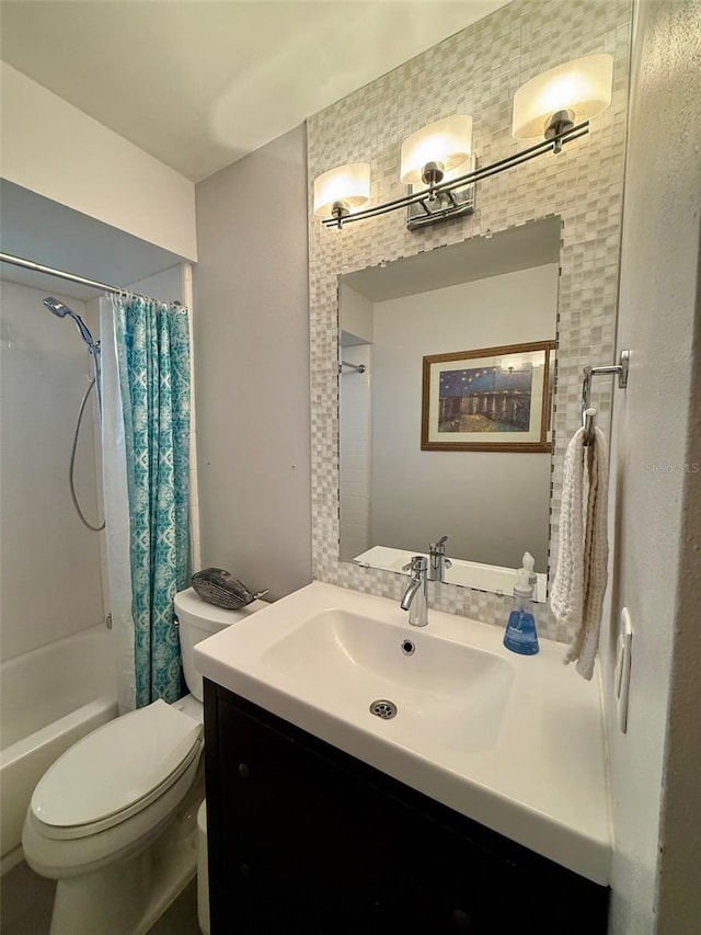 full bathroom with shower / bath combination with curtain, vanity, and toilet