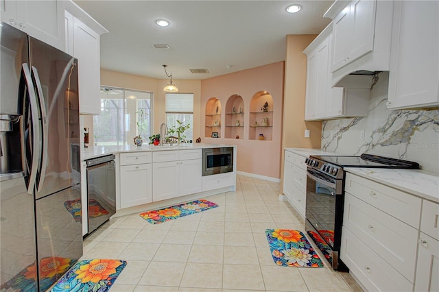 kitchen with light tile patterned floors, visible vents, appliances with stainless steel finishes, a sink, and a peninsula