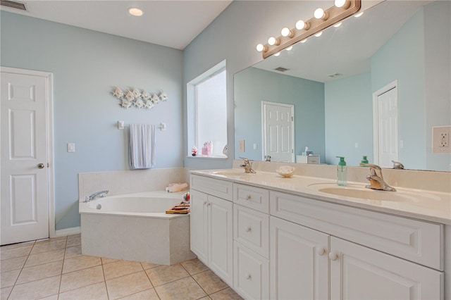 full bathroom featuring double vanity, a sink, a bath, and tile patterned floors