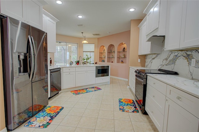 kitchen with light tile patterned floors, visible vents, a peninsula, black appliances, and a sink