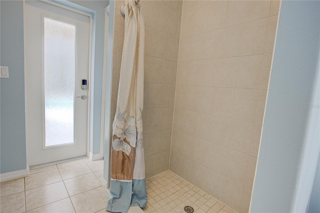 full bath with a stall shower and tile patterned flooring