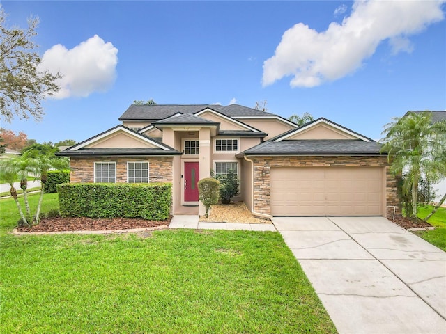 view of front of house with an attached garage, driveway, a front yard, and stucco siding