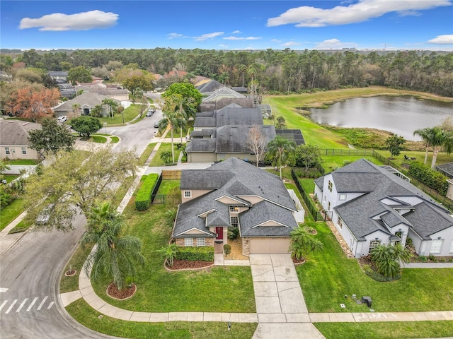 drone / aerial view featuring a water view and a residential view