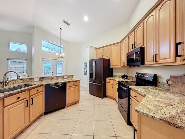 kitchen with visible vents, a sink, black appliances, and light brown cabinetry