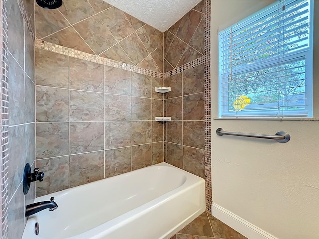 full bathroom featuring baseboards, tub / shower combination, a textured ceiling, and tile patterned floors