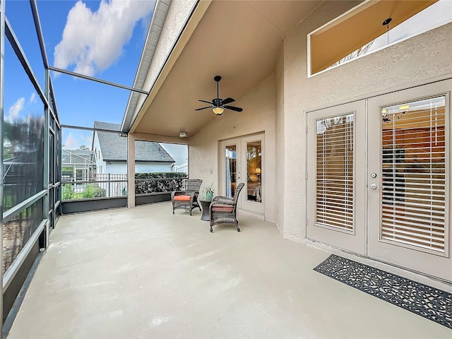 sunroom / solarium with ceiling fan, french doors, and vaulted ceiling