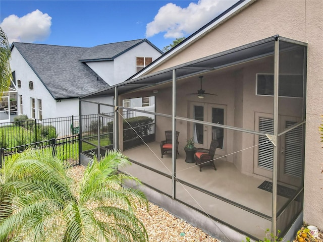 rear view of property featuring a patio area, fence, a ceiling fan, and stucco siding