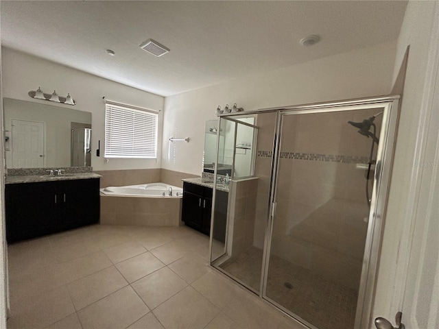 bathroom with visible vents, a garden tub, tile patterned flooring, vanity, and a shower stall