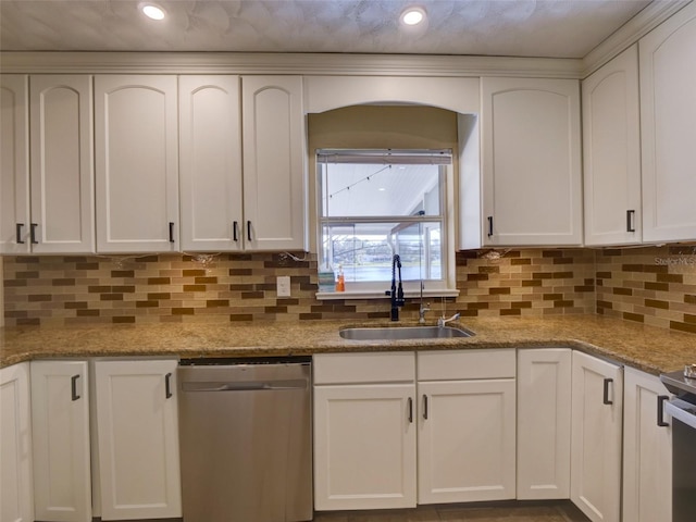 kitchen featuring white cabinets, a sink, and stainless steel dishwasher