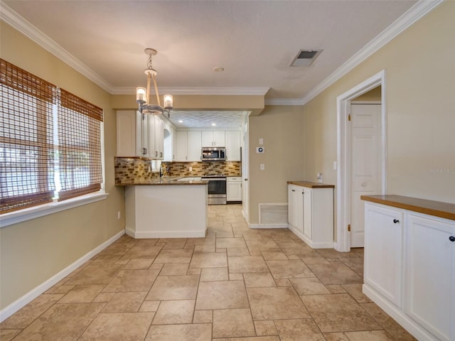 kitchen featuring visible vents, white cabinets, appliances with stainless steel finishes, crown molding, and backsplash