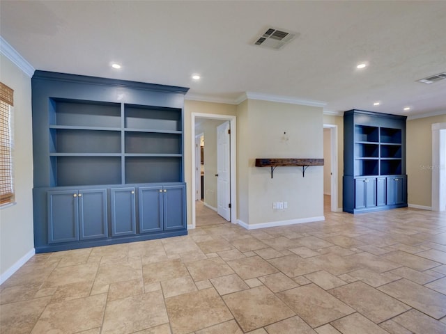 unfurnished room with baseboards, visible vents, and built in features