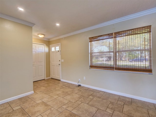 entrance foyer with ornamental molding, recessed lighting, and baseboards