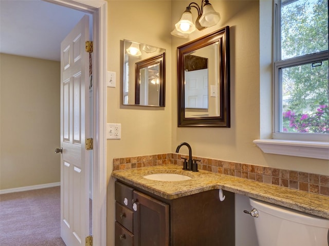 half bath with vanity and toilet