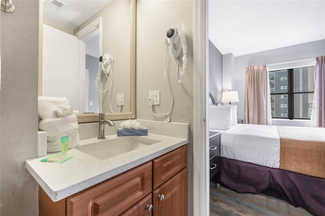 bathroom with vanity and visible vents