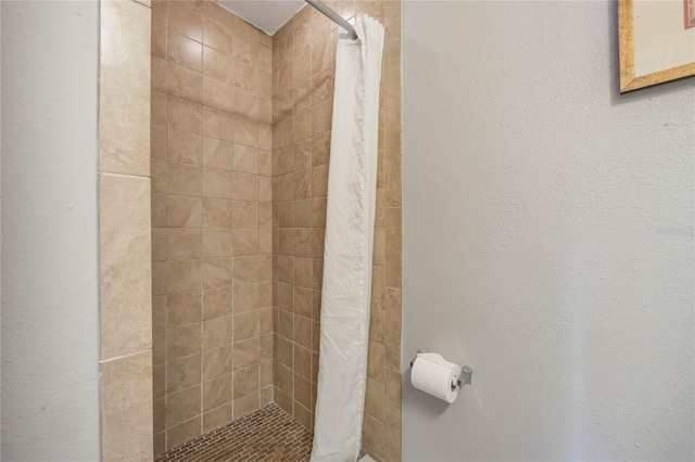 full bathroom with a shower stall