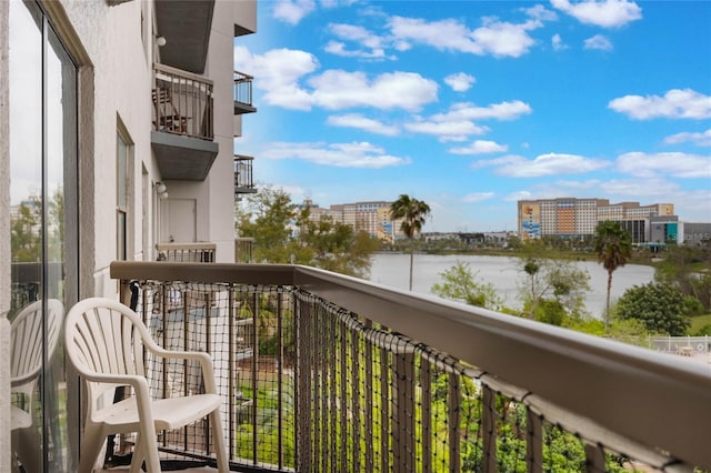 balcony featuring a water view