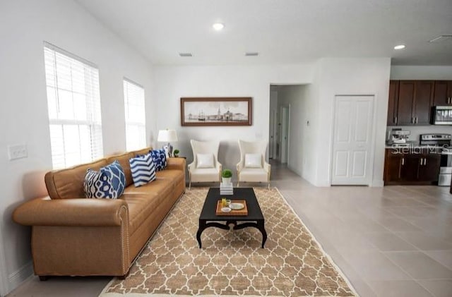living room with visible vents and recessed lighting