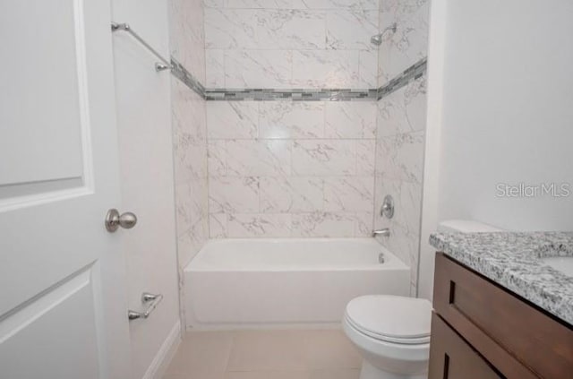 bathroom featuring toilet, tile patterned flooring, vanity, and shower / bathtub combination