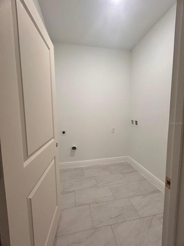 washroom featuring washer hookup, marble finish floor, baseboards, laundry area, and hookup for an electric dryer