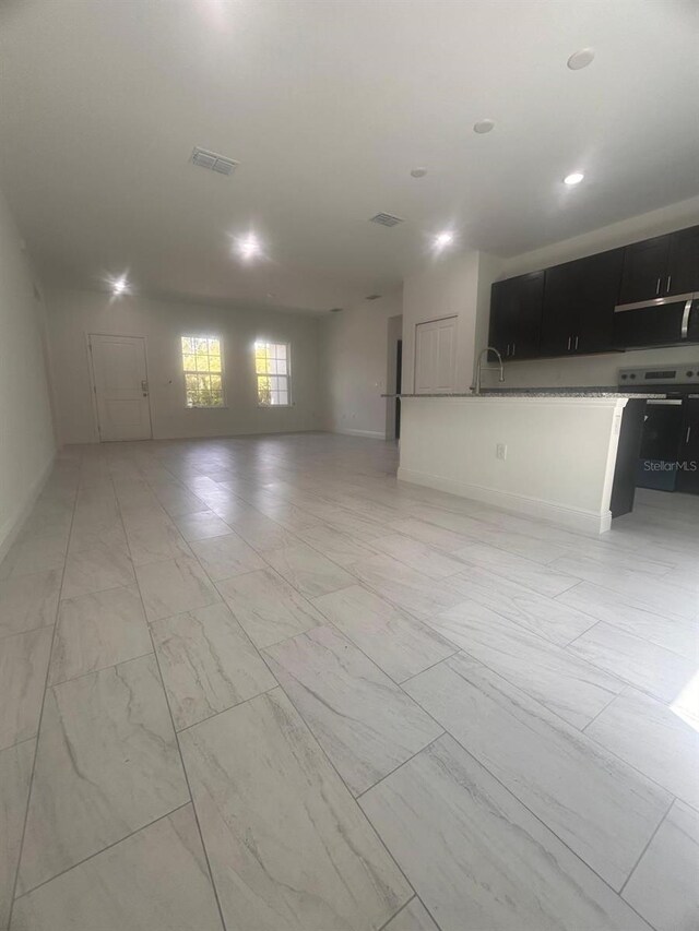 9451 N Emellia Ave, Citrus Springs, FL 34433 - unfurnished living room with light marble finish floors